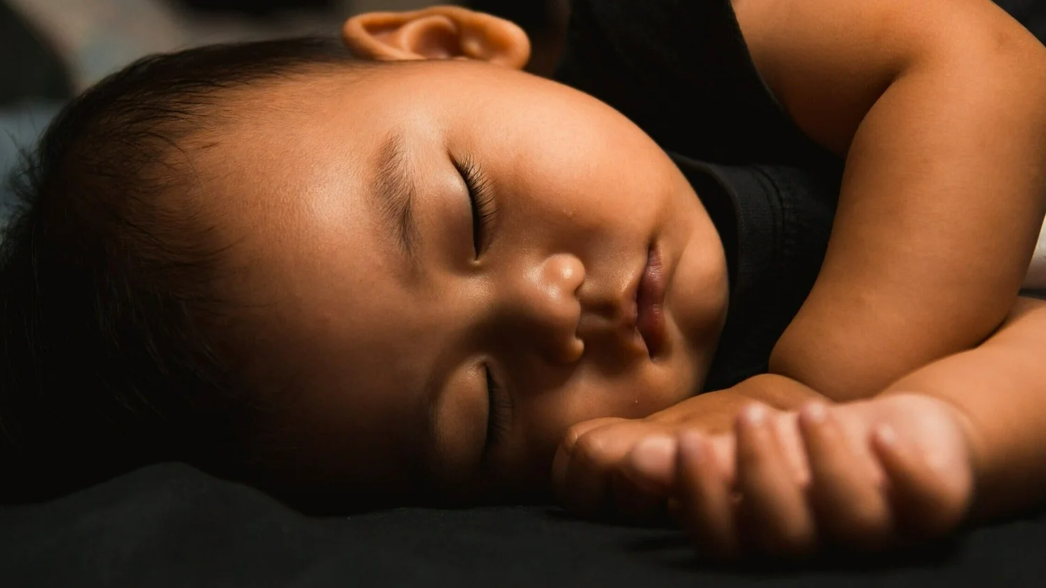 A young child sleeping peacefully, from the original Sleepy Bunnies website